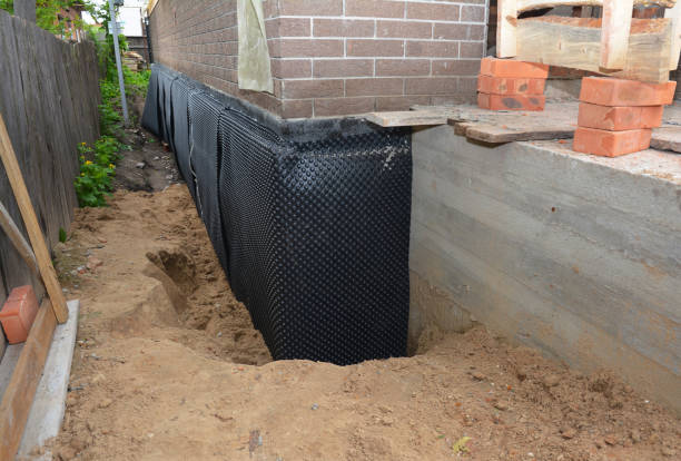 SJ Waterproofing Pros technician performing targeted Interior Drainage System assessment in Aurora, MN